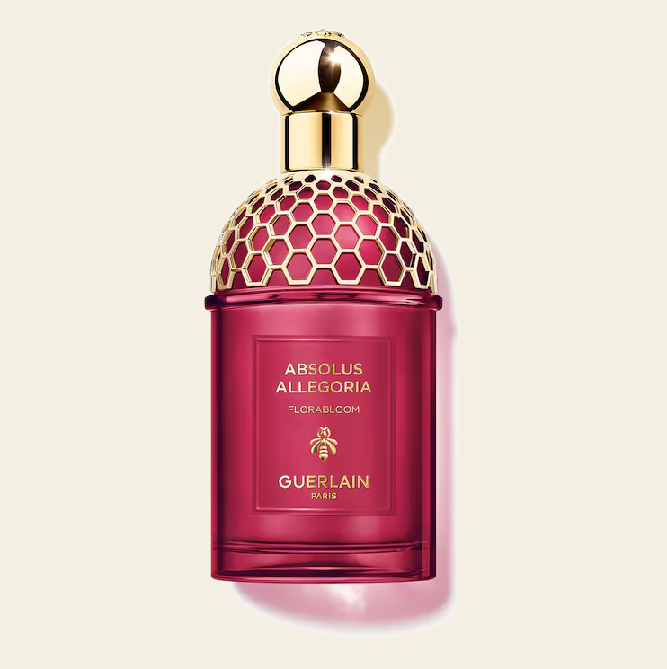 Flacon de parfum Florabloom Absolu Allegoria par Guerlain sur fond ivoire