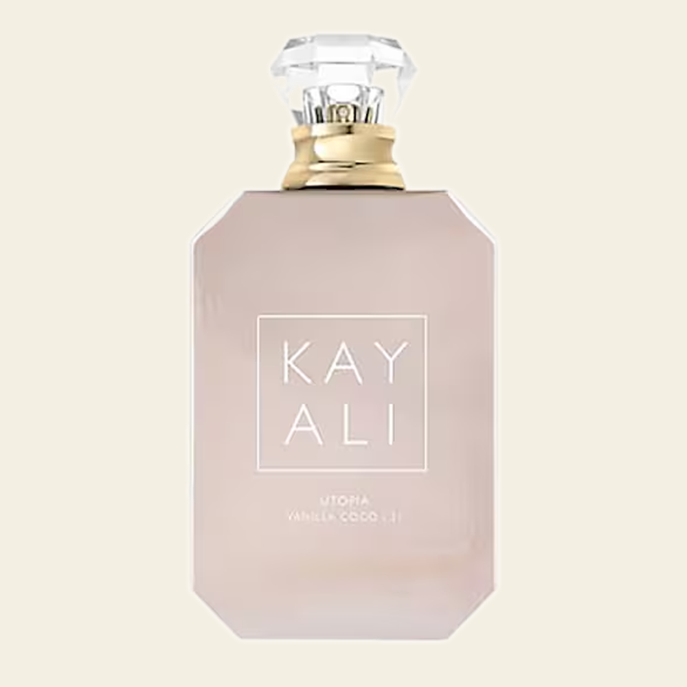 Flacon de parfum Utopia Vanilla Coco 21 par Kayali sur fond ivoire