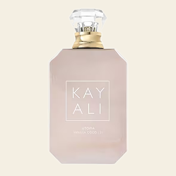 Flacon de parfum Utopia Vanilla Coco 21 par Kayali sur fond ivoire