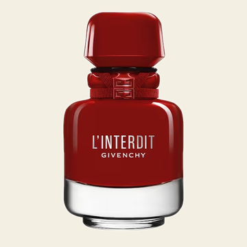 Flacon rouge du parfum L'Interdit Rouge par Givenchy sur fond ivoire