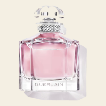 Flacon de parfum Mon Guerlain Sparkling Bouquet par Guerlain sur fond ivoire
