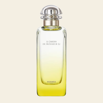Flacon de parfum Le Jardin de Monsieur Li par Hermès sur fond ivoire