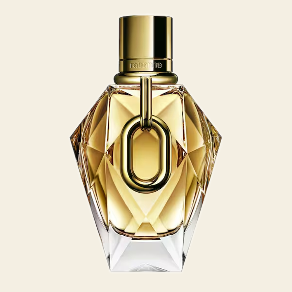 Flacon de parfum Million Gold par Rabanne sur fond ivoire