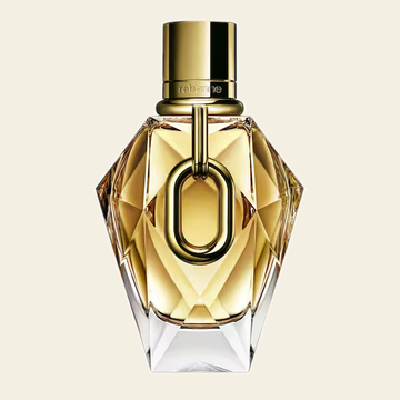 Flacon de parfum Million Gold par Rabanne sur fond ivoire