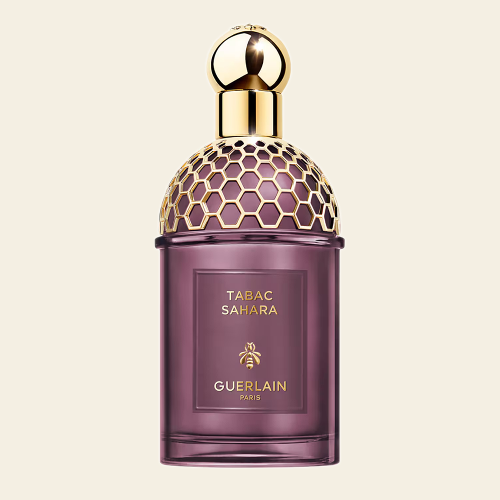 Flacon de parfum Tabac Sahara par Guerlain sur fond ivoire