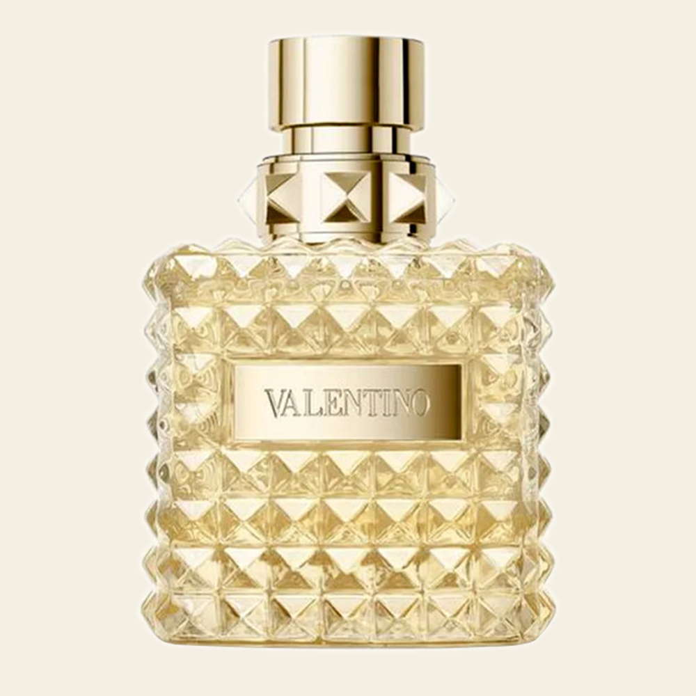 Flacon de parfum Born In Roma Yellow Dream par Valentino sur fond ivoire