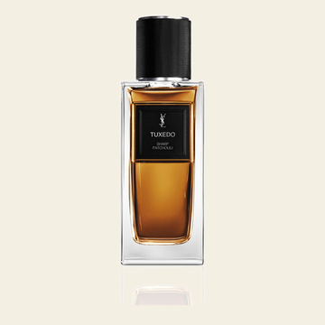 Flacon de parfum Tuxedo par Yves Saint Laurent sur fond ivoire