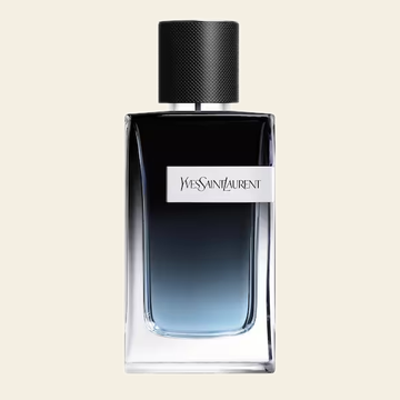 Flacon de parfum Y Eau de Parfum par Yves Saint Laurent sur fond ivoire